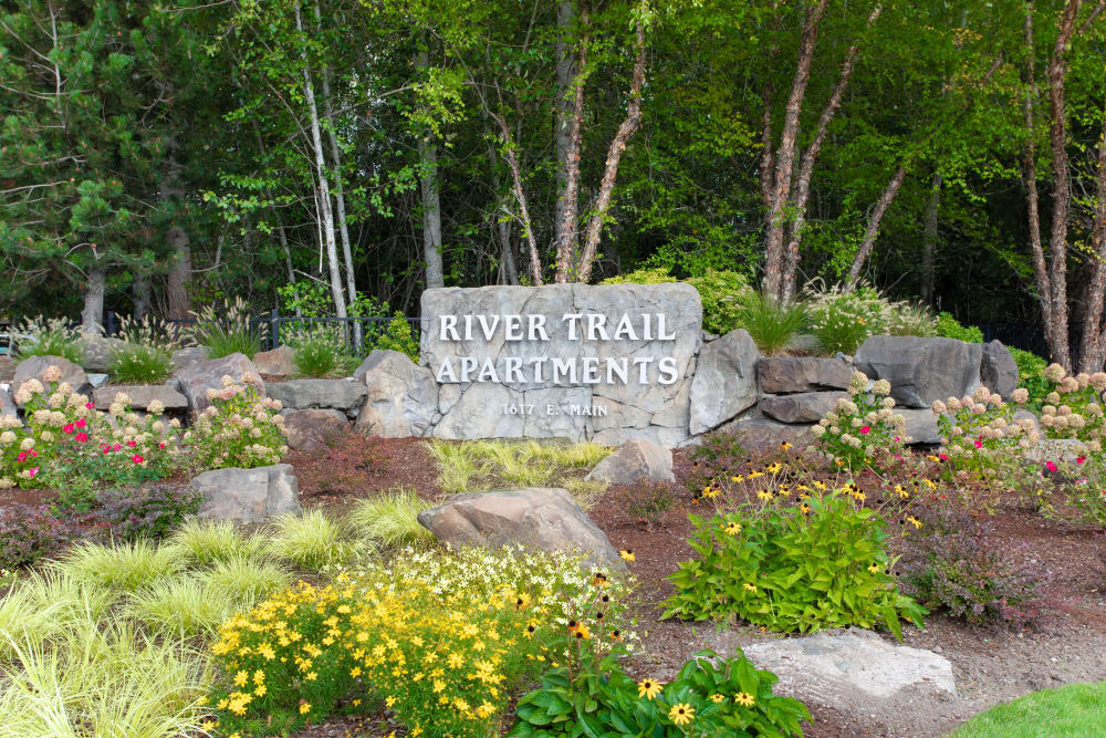 Community signage at River Trail Apartments in Puyallup, Washington