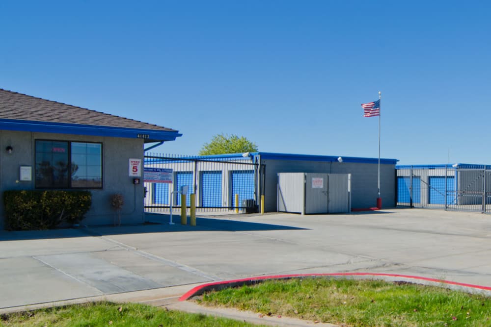 Fenced outdoor storage units at A-American Self Storage in Palmdale, California