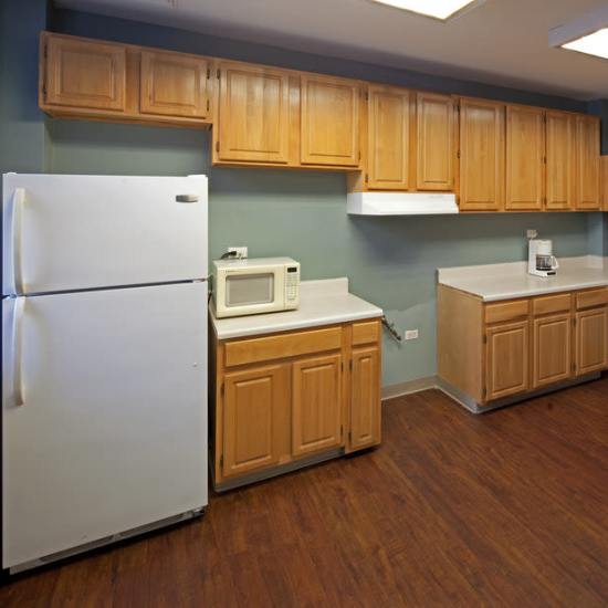 Kitchen with full-sized appliances at The Caroline in New York, New York 