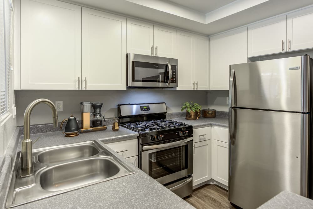 Renovated white kitchen cabinetry at Village Oaks in Chino Hills, California