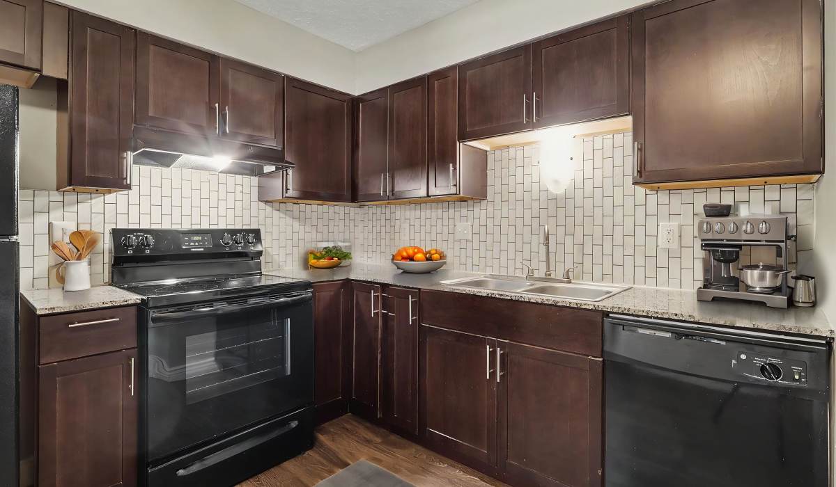 Kitchen with dark cabinets at Wildewood Commons in Ralston, Nebraska
