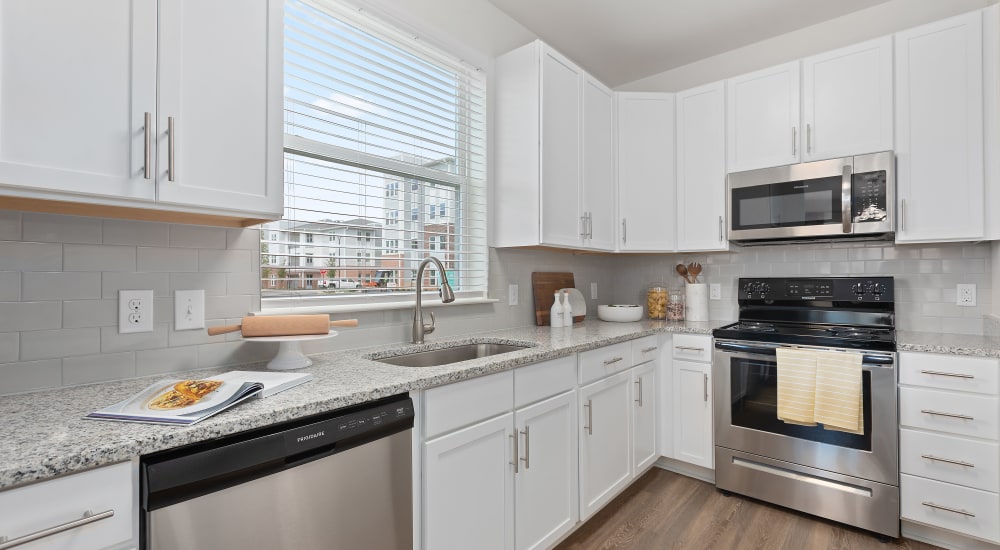 Modern kitchen with stainless-steel appliances at Archer at Brookhill in Charlottesville, Virginia