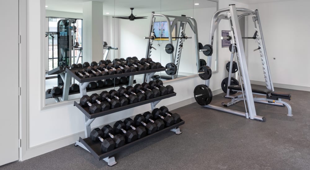 Community gym with free weights at Bellrock Memorial in Houston, Texas