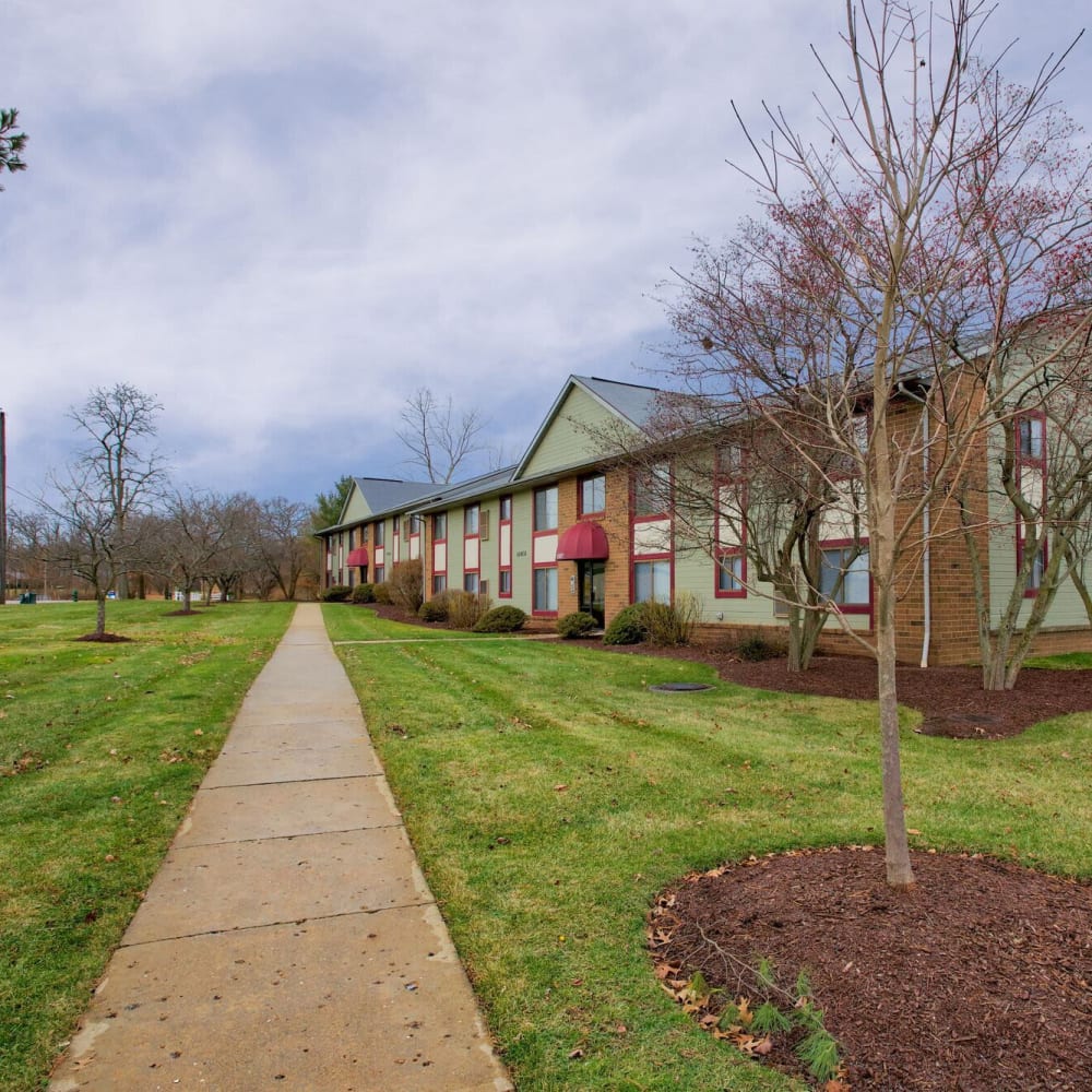 A pathway runs through the lush green lawn at Ravenna Woods, Twinsburg, Ohio