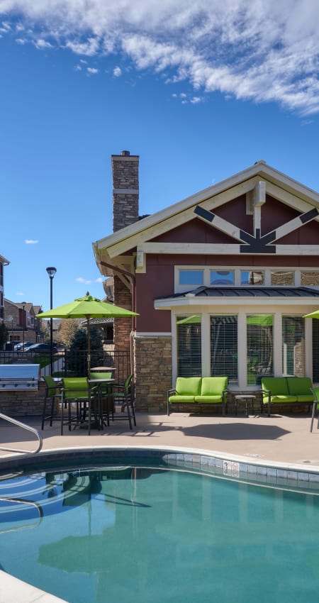 Pool area with lounges at M2 Apartments in Denver