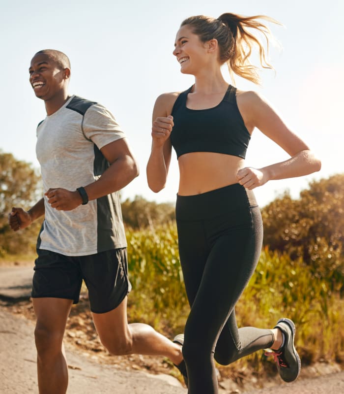 Resident jogging near Montecito Apartments at Carlsbad in Carlsbad, CA