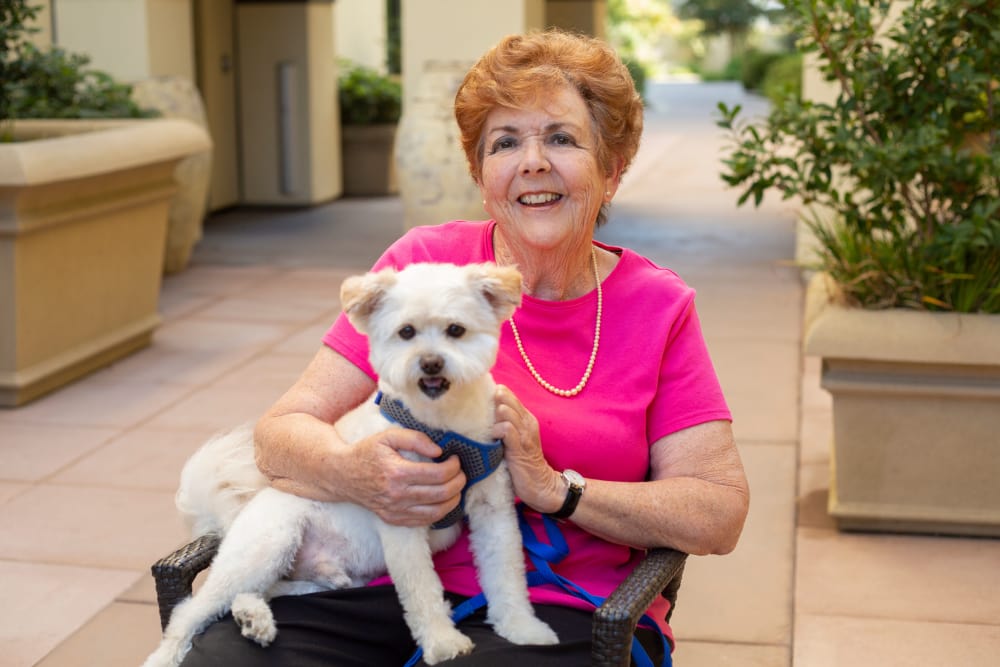 Resident with pet at our senior living community in Rolling Hills Estates