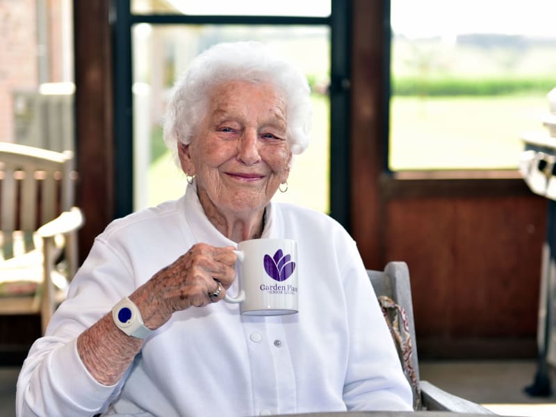 Resident enjoying coffee at Garden Place Columbia in Columbia, Illinois. 