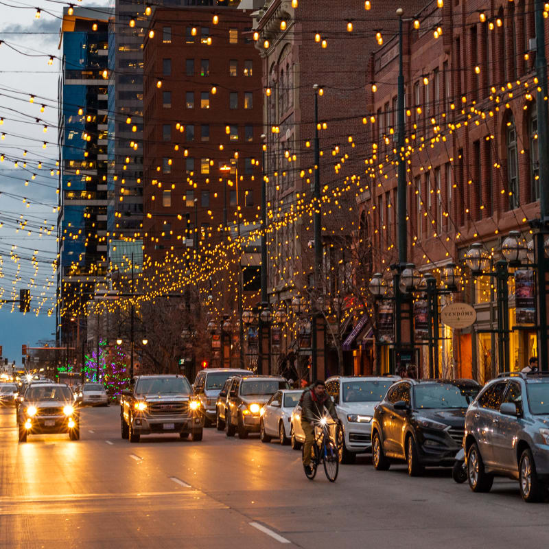 Twinkle lights above the street at Civic Lofts in Denver, Colorado