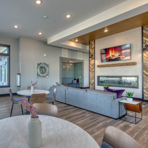 Lounge area with seating and fireplace at The Mason in Augusta, Georgia