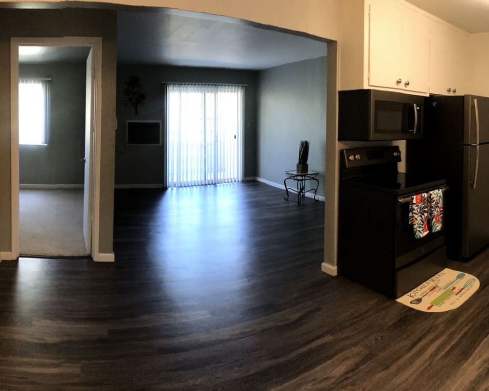 Living space with wood style floors at Courtyard in Hayward, California