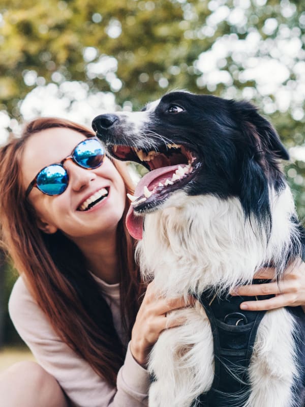 Woman holding her dog at Bellrock Upper North in Haltom City, Texas