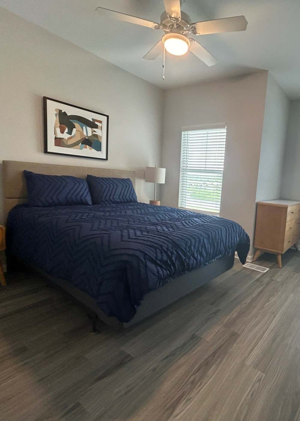 Spacious bedroom with large bed and ceiling fan at Las Colinas in Foley, Alabama