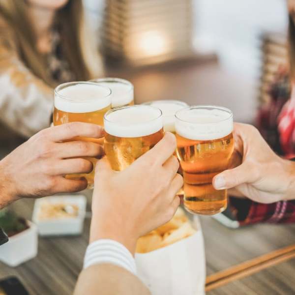 A group of friends toasting their glasses at Regency Apartment Homes in Williston, North Dakota