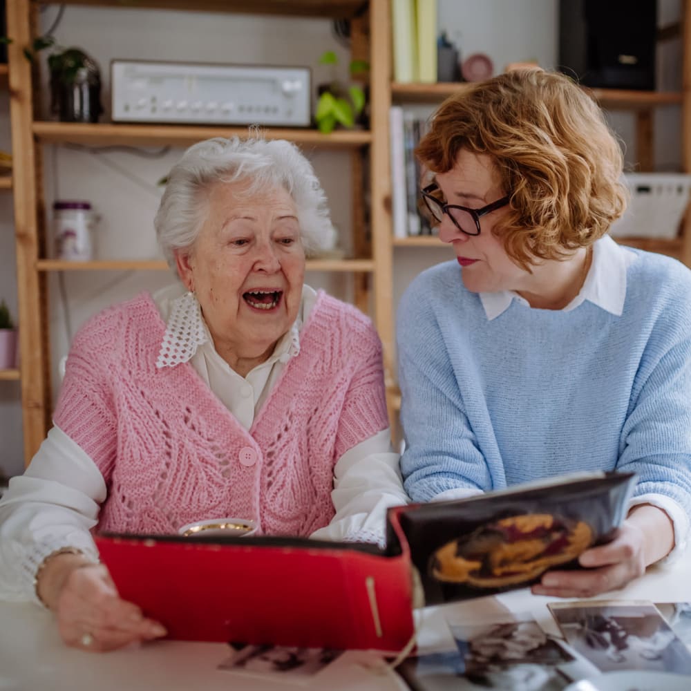 A smiling resident enjoying a health meal at Ridge at Frisco in Frisco, Texas