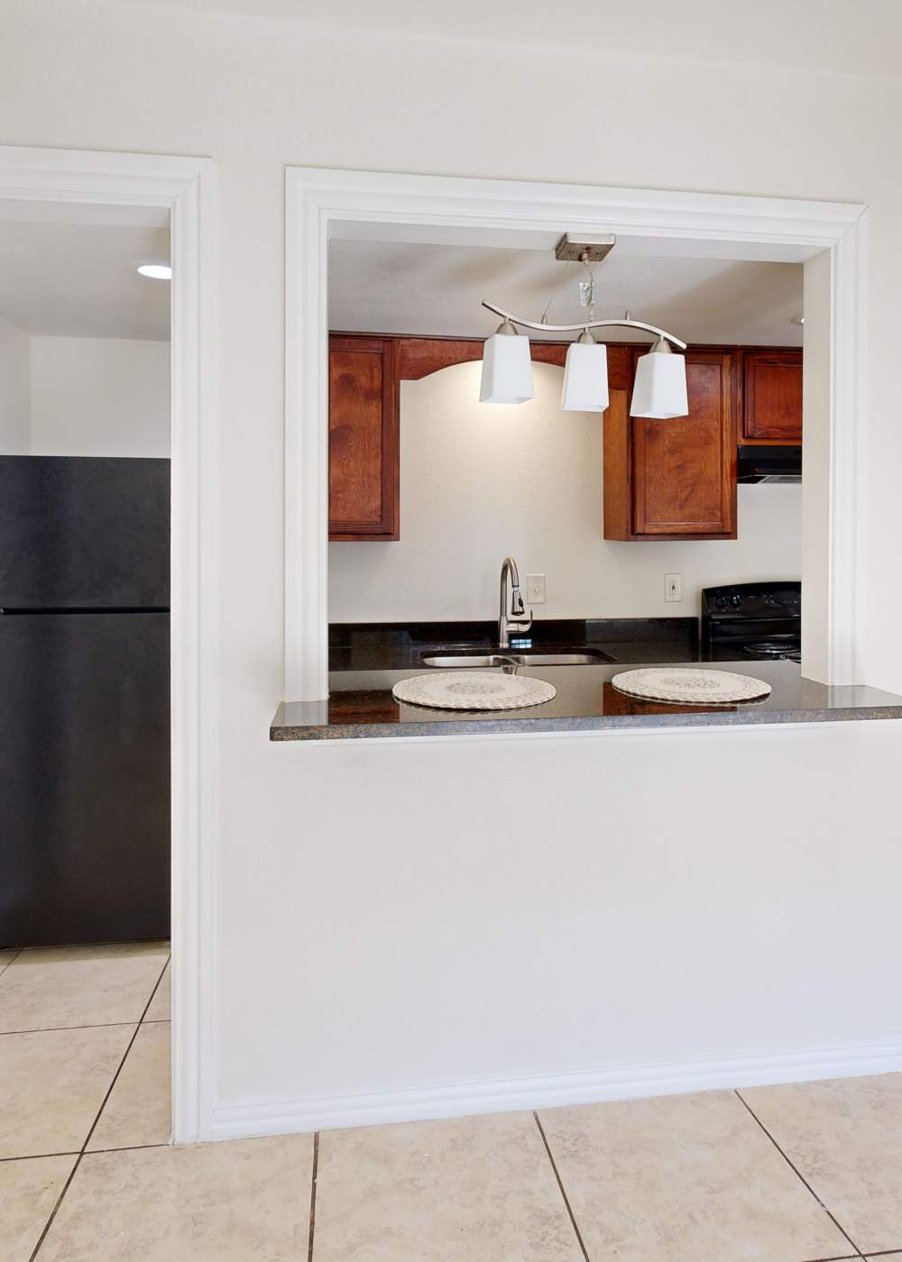 Modern kitchen with energy-efficient appliances at Tucasa Townhomes in Irving, Texas