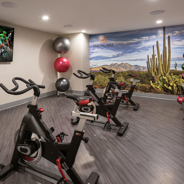 Three indoor spin bikes in gym at San Palmas in Chandler, Arizona