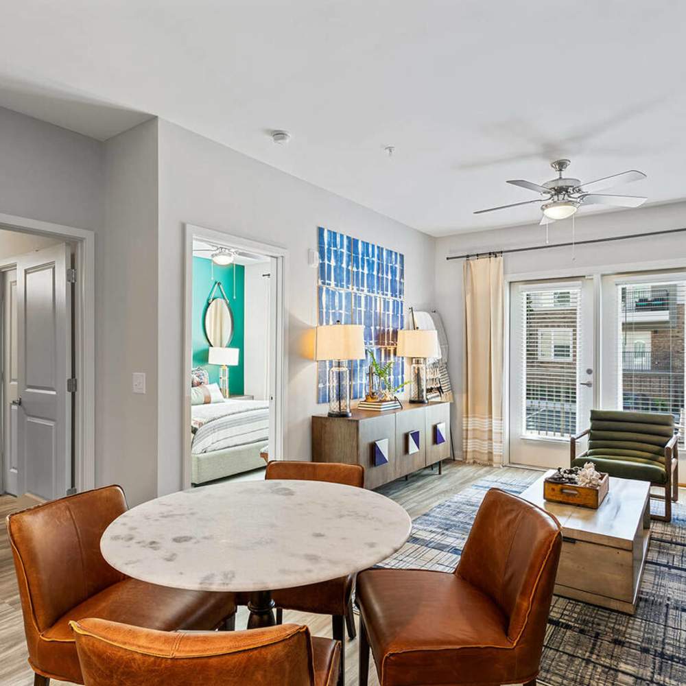 Modern living room with dining area at The Reid in Tucker, Georgia