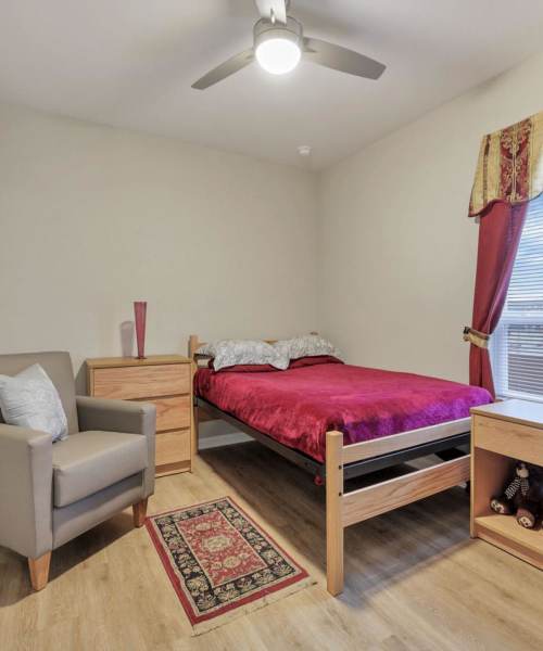 Bedroom with a ceiling fan at McKinley Manor in Columbus, Ohio