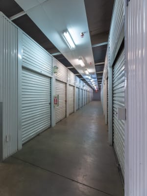 An aisle of storage units inside Nova Storage in South Gate, California