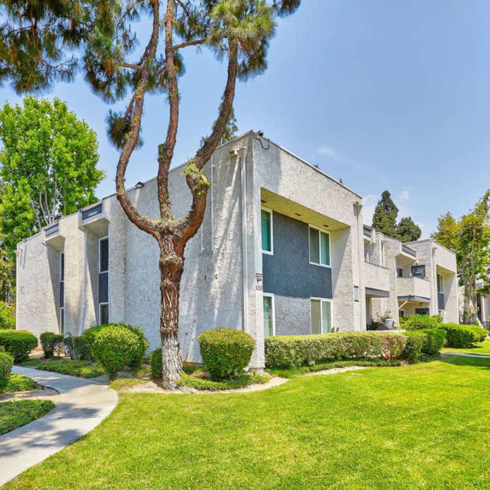 Community exterior with green lawn at Pendleton Arms in Sun Valley, California