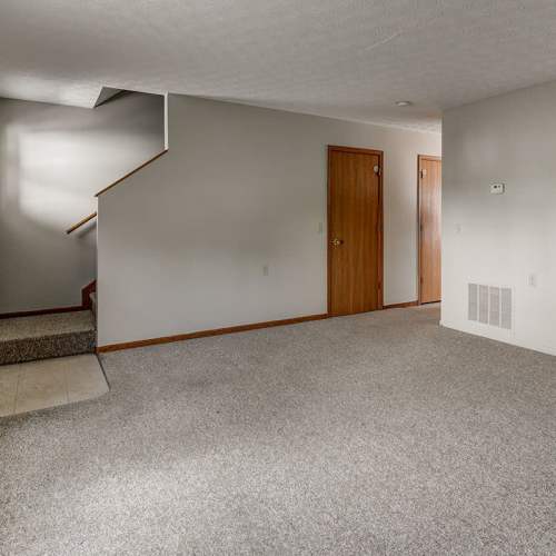 Living room with air conditioning at Edwards Crossing I in Beaver, West Virginia