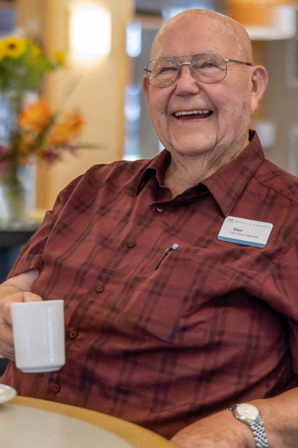Resident having coffee | Merrill Gardens in Seattle, Washington