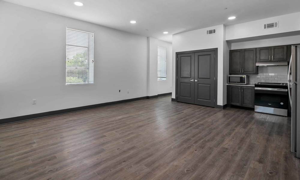 Kitchen of an apartment with connecting living room at The Lofts at the Municipal in Lafayette, Louisiana
