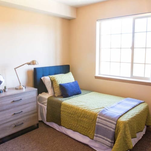 An apartment bedroom at The Quad at Kirkwood in Cedar Rapids, Iowa