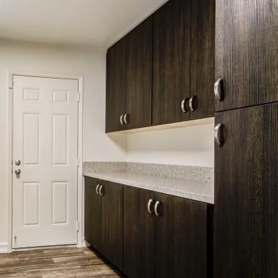 Storage in the laundry room of a home at Admiral Hartman in San Diego, California