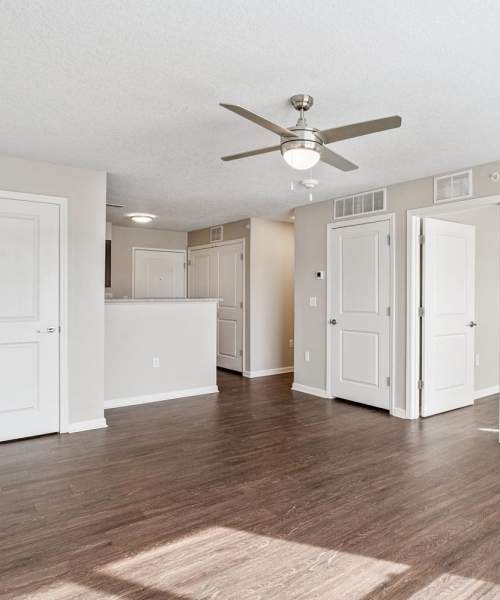 Living room with access to kitchen at Johnston Crossing II in Johnston, Iowa