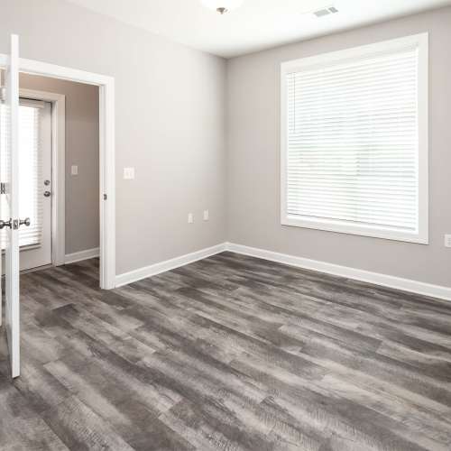 Unfurnished bedroom with large window and blind at Mills Creek in Gastonia, North Carolina