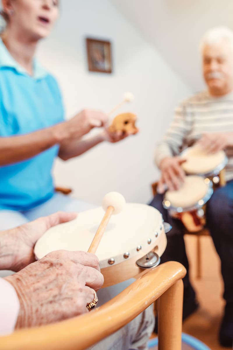 Residents playing instruments together at Ingleside Communities in Mount Horeb, Wisconsin