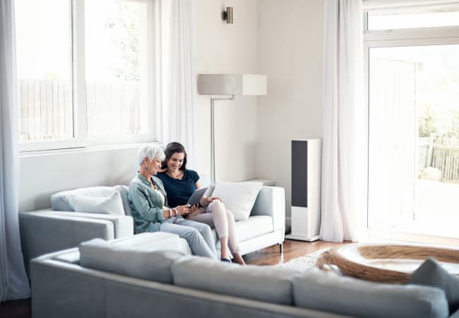Resident and a caretaker at a Seasons Living community