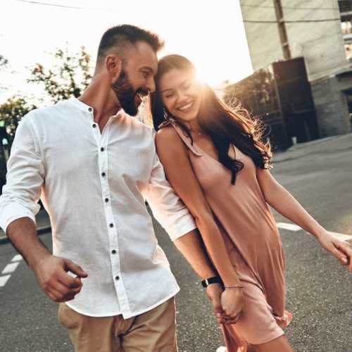 Resident couple walking near The George Apartment Homes in Anaheim, California