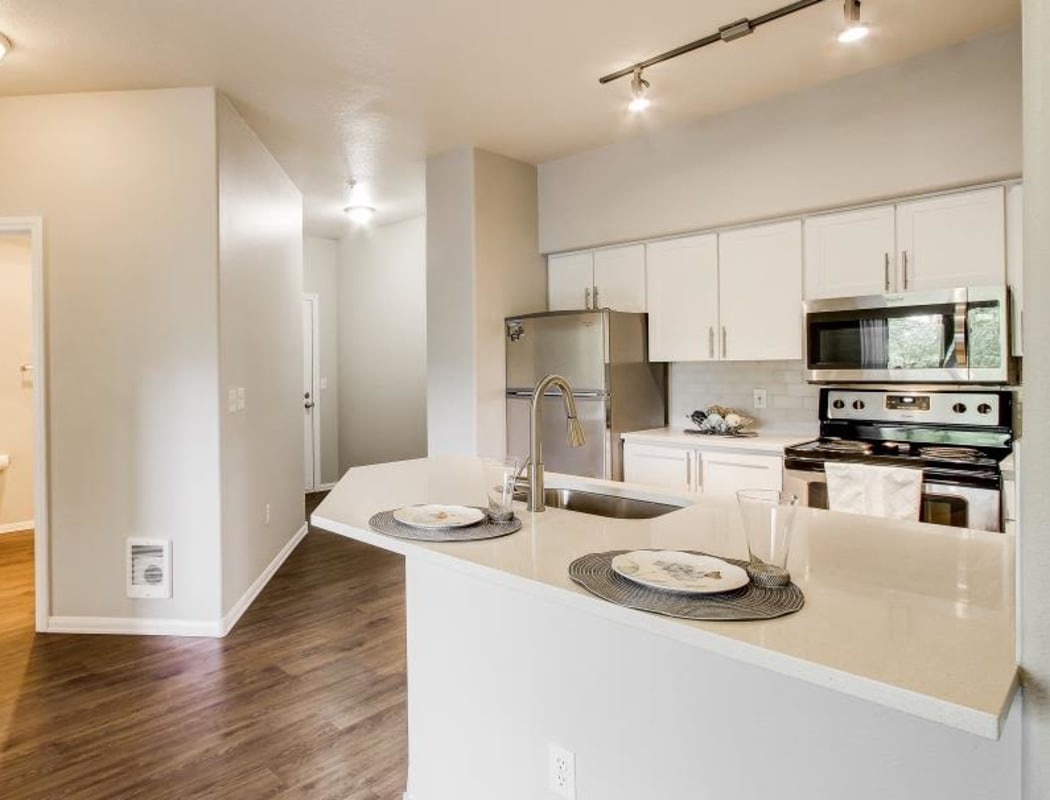 Kitchen area with an open-concept model home at Columbia Trails in Gresham, Oregon