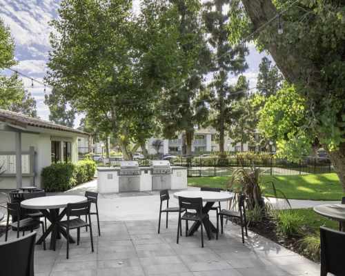 Patio with barbeque stations at Breve Park Apartment Homes, Anaheim, California