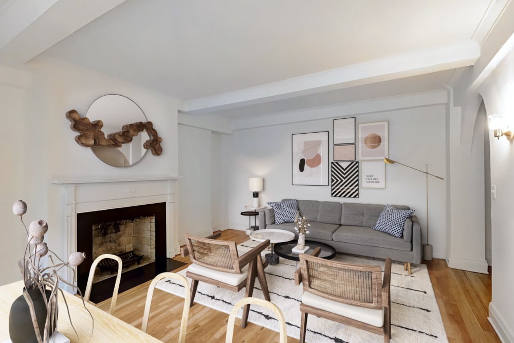 Large living room with a large mirror at The Sutton Collection in New York, New York