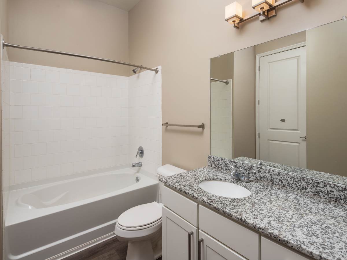 Gated granite countertop with sink and mirror at Ardmore & Twenty Eighth in Atlanta, Georgia