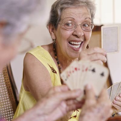 Residents enjoying a friendly game of cards at The Renaissance of Stillwater in Stillwater, Oklahoma