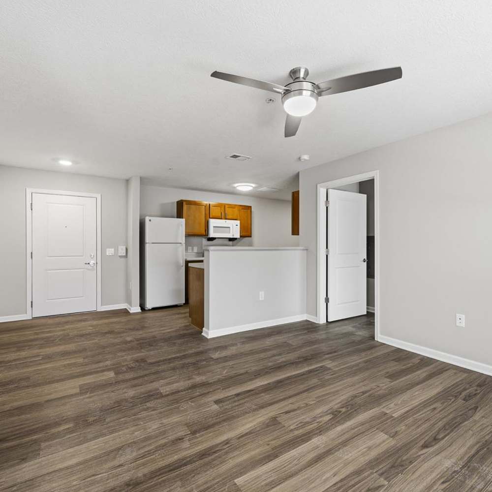 A living room with wood-style floor at Granville Woods Lofts II in Columbus, Ohio