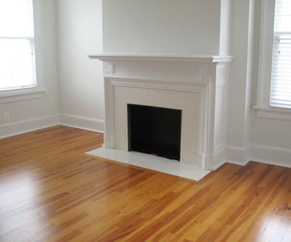 A bright master bedroom with a fireplace at Porter Road in Annapolis, Maryland