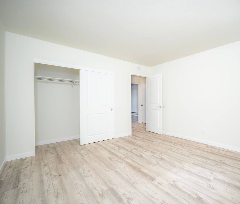 Unfurnished bedroom with walk-in closet at The Chateau Apartments in Mountain View, California