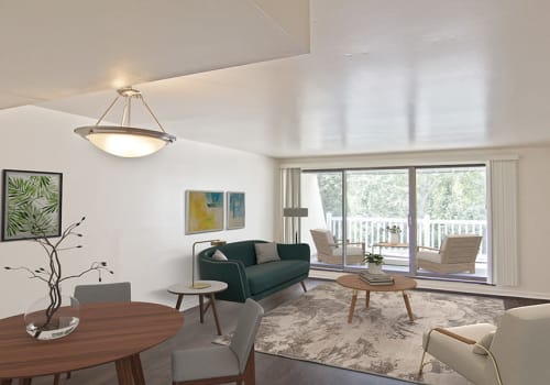 Living room with patio access at The Cascades Townhomes and Apartments in Pittsburgh, Pennsylvania