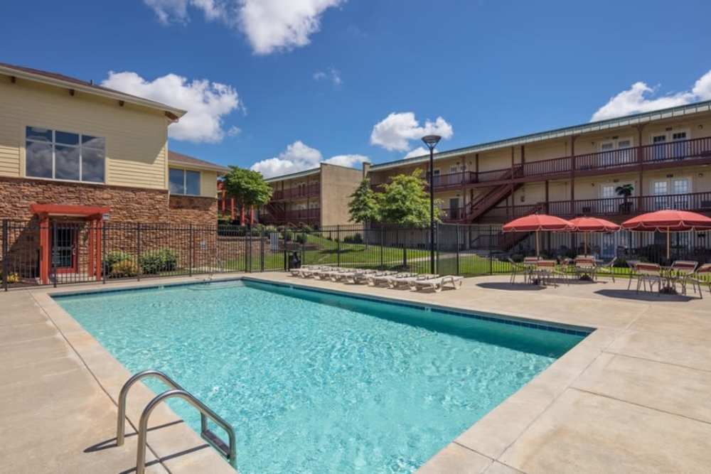 Swimming pool with canopy and  lounge seating at Tiger Village in Columbia, Missouri
