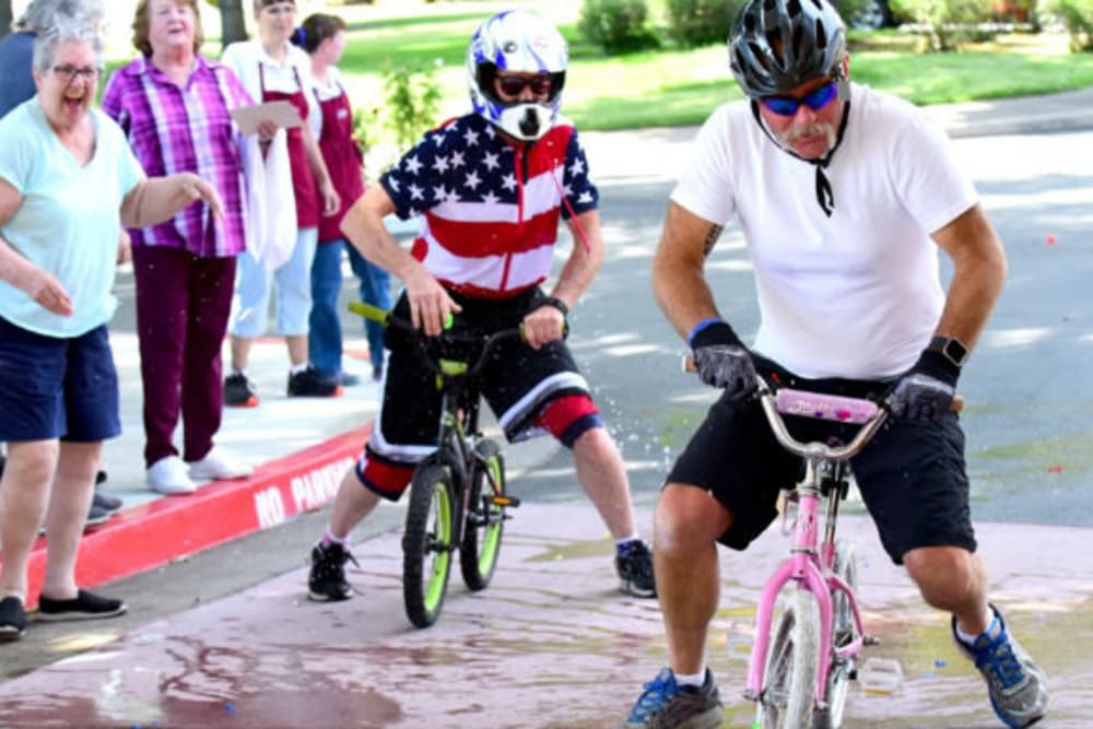 Resident enjoying a fun bike event at River Commons Senior Living in Redding, California