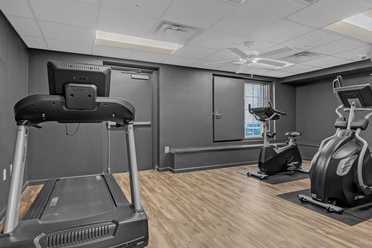 Fitness center with wood flooring at Whittier Heights in Tulsa, Oklahoma 