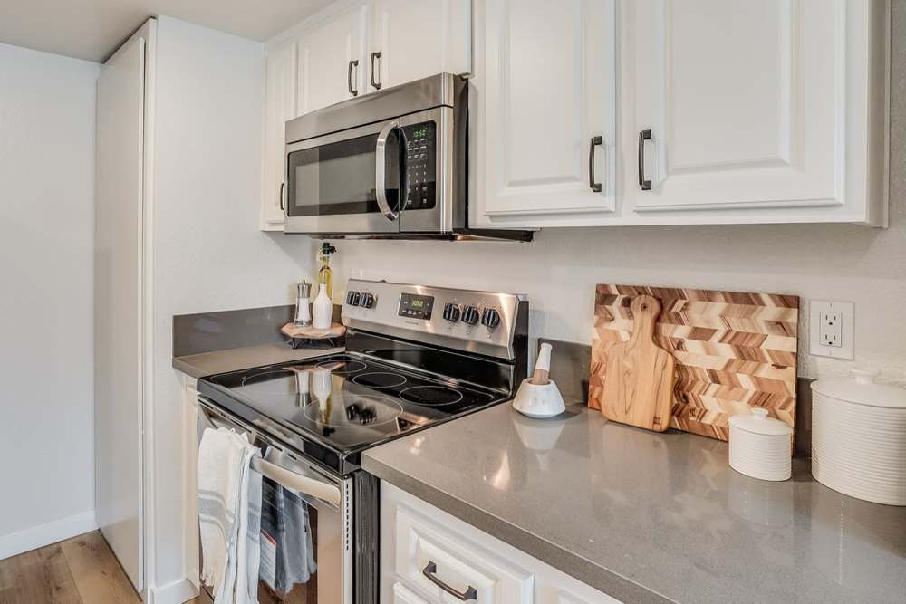 Modern Kitchen with Stove, oven and microwave at Trails at 2112 in Modesto, California.