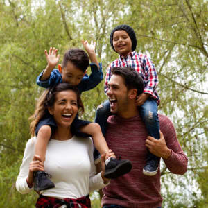 Family on a walk at a park near Parkway Villas in Grand Prairie, Texas