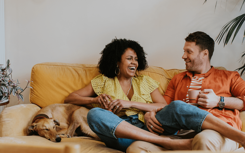 Couple relaxing with their dog at Kenect 